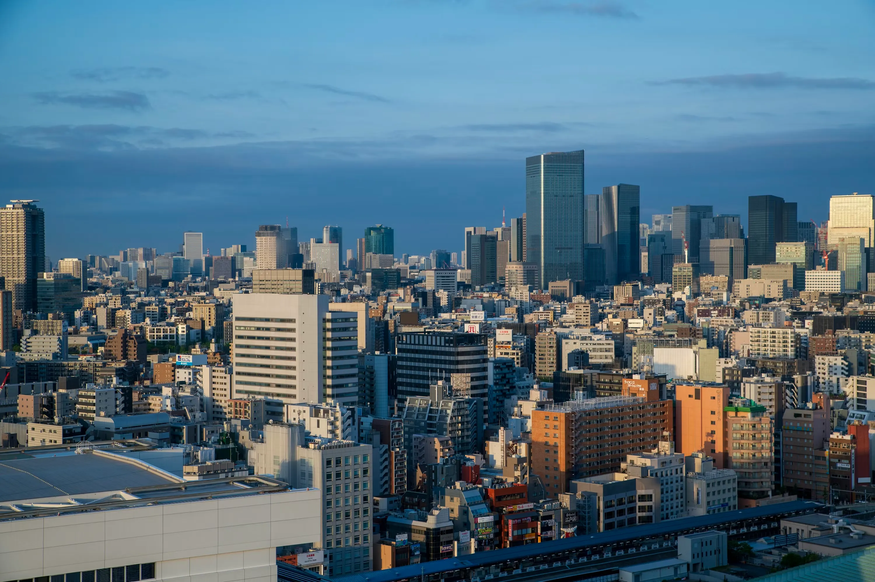 Modern city skyline with buildings of varying heights and green spaces representing urban exploration activities